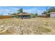 Expansive backyard featuring a fire pit and outdoor seating area, perfect for gatherings at 3311 Florida Blvd, Bradenton, FL 34207
