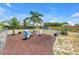 Wide angle view of a large backyard featuring a fire pit and outdoor seating area at 3311 Florida Blvd, Bradenton, FL 34207