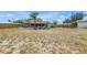 Expansive backyard featuring a fire pit and outdoor seating area, perfect for gatherings at 3311 Florida Blvd, Bradenton, FL 34207