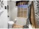 Cozy bathroom with window, white commode and zebra print shower curtain at 3311 Florida Blvd, Bradenton, FL 34207