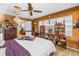 Bright bedroom featuring a view to the living room, wood laminate flooring and ample shelving at 3311 Florida Blvd, Bradenton, FL 34207