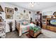 Comfortable bedroom featuring a colorful quilt, vintage furniture and a view to the back yard at 3311 Florida Blvd, Bradenton, FL 34207