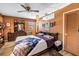 Cozy bedroom featuring a unique ceiling fan, decorative lighting and wood laminate flooring at 3311 Florida Blvd, Bradenton, FL 34207