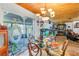 Bright dining area featuring a glass table and a view to the sunroom at 3311 Florida Blvd, Bradenton, FL 34207