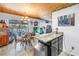 Cozy dining area with a glass table, chandelier, and adjacent fish tank feature at 3311 Florida Blvd, Bradenton, FL 34207