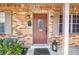 A beautiful brick entrance featuring a decorative glass front door and covered porch at 3311 Florida Blvd, Bradenton, FL 34207