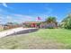 Well-maintained lawn and landscaping highlight this cozy single-story home at 3311 Florida Blvd, Bradenton, FL 34207