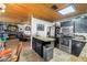 Open kitchen with stainless steel appliances and a view into the living area at 3311 Florida Blvd, Bradenton, FL 34207