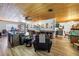 Open living space with wood floors, wood ceiling, and a view of the dining area at 3311 Florida Blvd, Bradenton, FL 34207