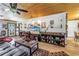 Spacious living room with wood floors, a wooden ceiling, and a brick fireplace at 3311 Florida Blvd, Bradenton, FL 34207