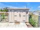 Exterior view of a well-maintained storage shed with secure doors and hardware at 3311 Florida Blvd, Bradenton, FL 34207