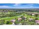 Stunning aerial view of a golf course community with lush landscaping and beautiful homes at 3388 Highlands Bridge Rd, Sarasota, FL 34235