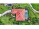 Overhead view of a house with a screened pool area, surrounded by lush landscaping and mature trees at 3388 Highlands Bridge Rd, Sarasota, FL 34235