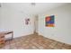 Bright bedroom with terracotta tile flooring, white walls, and ample closet space offers a modern look at 3388 Highlands Bridge Rd, Sarasota, FL 34235