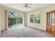 Bedroom featuring large glass sliding doors and a wardrobe at 3388 Highlands Bridge Rd, Sarasota, FL 34235