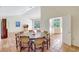 Charming dining room that has an open concept feel with the spacious living room and kitchen at 3388 Highlands Bridge Rd, Sarasota, FL 34235
