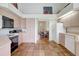 Neutral kitchen with terracotta tile, modern appliances, and easy access to the dining room at 3388 Highlands Bridge Rd, Sarasota, FL 34235