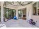 Covered lanai featuring tile flooring, screened windows and exterior access at 3388 Highlands Bridge Rd, Sarasota, FL 34235