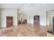 Open concept living room featuring high ceilings and tile floors, perfect for entertaining at 3388 Highlands Bridge Rd, Sarasota, FL 34235
