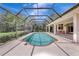 Inviting screened-in pool with an open patio, ideal for relaxation and entertaining in a private backyard setting at 3388 Highlands Bridge Rd, Sarasota, FL 34235