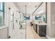 This bathroom offers a walk-in shower with glass door, a soaking tub, double sinks, and modern fixtures at 340 Jackson Dr, Sarasota, FL 34236