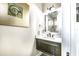 Elegant powder room featuring a modern vanity with marble countertop and stylish decor at 340 Jackson Dr, Sarasota, FL 34236