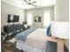 A spacious bedroom featuring a bed with blue accents and wood flooring at 340 Jackson Dr, Sarasota, FL 34236