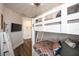 A bedroom with twin over full bunk beds and wood flooring at 340 Jackson Dr, Sarasota, FL 34236