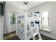 Bright bedroom featuring a bunk bed, natural light and stylish decor at 340 Jackson Dr, Sarasota, FL 34236