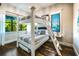 Bedroom featuring a bunk bed, natural light, and dark wood floors at 340 Jackson Dr, Sarasota, FL 34236