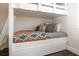 A close up view of the bunk beds with orange and blue patterned bedding at 340 Jackson Dr, Sarasota, FL 34236