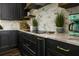 A stylish kitchen featuring sleek black cabinets, modern appliances, and elegant countertops at 340 Jackson Dr, Sarasota, FL 34236