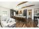 Open concept kitchen and living room featuring a large island and modern appliances at 340 Jackson Dr, Sarasota, FL 34236