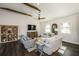 Bright living room featuring hardwood floors, decorative ceiling beams and comfortable furnishings at 340 Jackson Dr, Sarasota, FL 34236