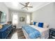 Cozy main bedroom featuring a ceiling fan, natural light and stylish decor at 340 Jackson Dr, Sarasota, FL 34236