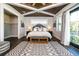 Spacious bedroom featuring wood ceiling, ensuite closet and outdoor patio at 340 Jackson Dr, Sarasota, FL 34236