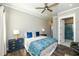 Cozy main bedroom featuring a ceiling fan, ensuite bathroom and stylish decor at 340 Jackson Dr, Sarasota, FL 34236