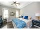 Cozy main bedroom featuring a ceiling fan, natural light and stylish decor at 340 Jackson Dr, Sarasota, FL 34236