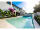 Relaxing backyard with a pool and blooming bougainvillea, perfect for outdoor living at 340 Jackson Dr, Sarasota, FL 34236