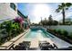 Tranquil pool area with lounge chairs, landscaped garden, and modern architectural details at 340 Jackson Dr, Sarasota, FL 34236