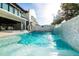 Backyard oasis featuring a gorgeous pool with serene waterfall wall and modern design at 340 Jackson Dr, Sarasota, FL 34236