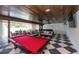 Entertaining room with pool table, casual seating, wood ceiling and checkered tile floor at 340 Jackson Dr, Sarasota, FL 34236