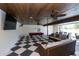 Recreation room with pool table, checkered tile flooring, comfortable seating and wood plank ceiling at 340 Jackson Dr, Sarasota, FL 34236