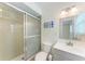Bathroom featuring a shower and a sleek vanity with ample natural light at 3707 Kingswood Dr, Sarasota, FL 34232
