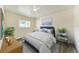 Comfortable bedroom with a ceiling fan, plenty of natural light, and stylish decor at 3707 Kingswood Dr, Sarasota, FL 34232