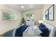 Bright bedroom boasts a ceiling fan, and a large window with a lovely view at 3707 Kingswood Dr, Sarasota, FL 34232