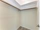 Spacious walk-in closet features neutral paint, wood-look floors and ample storage space at 3707 Kingswood Dr, Sarasota, FL 34232