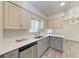 Modern kitchen with stainless steel appliances, bright cabinets, and elegant countertop at 3707 Kingswood Dr, Sarasota, FL 34232