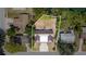 An aerial view of a home with metal roof, neat landscaping and clearly marked property lines at 3921 Marlborough Pl, Sarasota, FL 34241