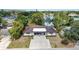 Aerial shot of property featuring mature trees and a partial lake view at 3921 Marlborough Pl, Sarasota, FL 34241